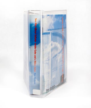 Two-Way Mirror Cylinder Inside Cube and a Video Salon