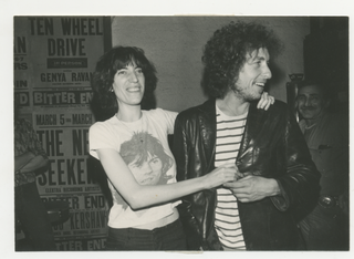 Item #6329 [Bob Dylan, Patti Smith] Review of Planet Waves with Photograph of Dylan and Smith....