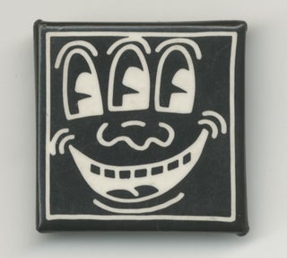 Item #6362 White on Black Three-Eyed Smiley Face Pin. Keith Haring