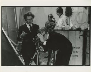 Item #6547 Andy Warhol Operating a Bolex Camera. Billy Name