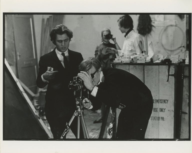 Item #6547 Andy Warhol Operating a Bolex Camera. Billy Name.