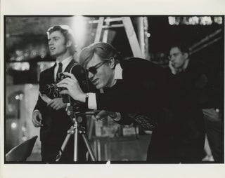 Item #6548 Andy Warhol Operating a Bolex Camera. Billy Name