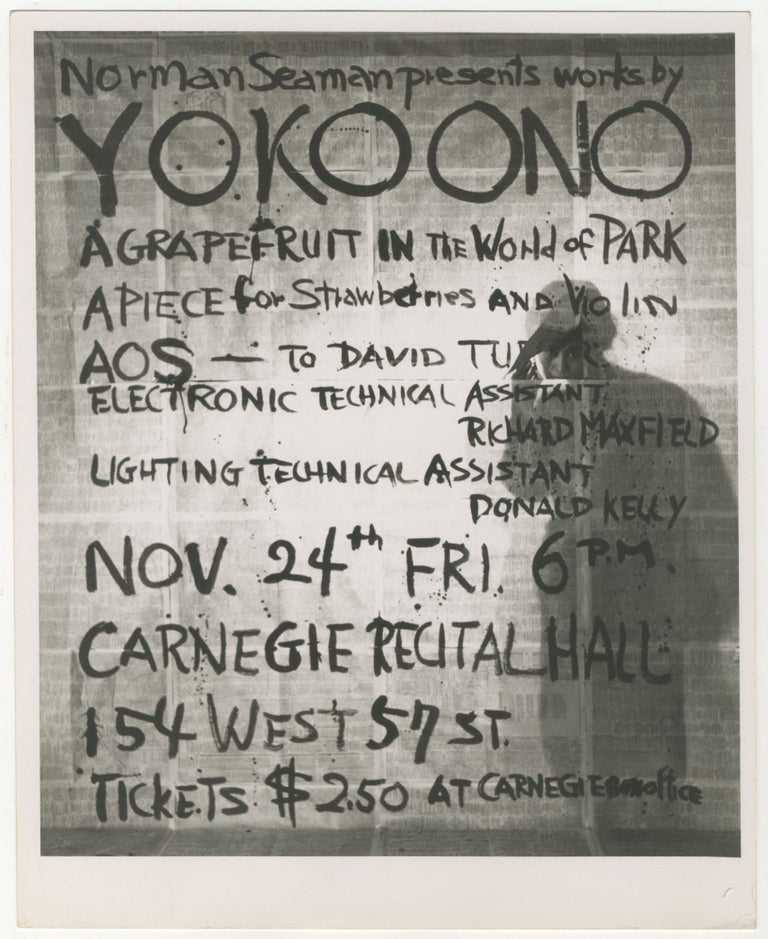 Item #6646 Photograph of Yoko Ono with Poster for Works of Yoko Ono at Carnegie Recital Hall. Yoko Ono.