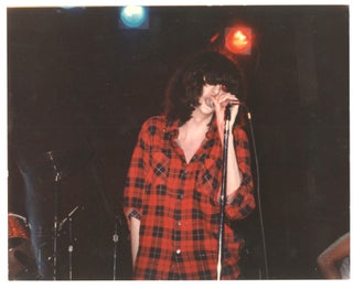 Item #8164 Photograph of Joey Ramone on stage at CBGB